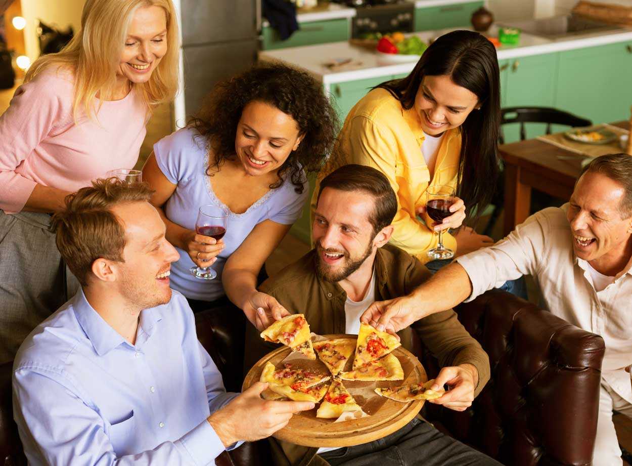 people are eating pizza image